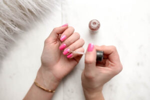 manicure | painting fingernails | pink fingernail polish