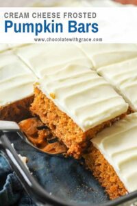 Cream Cheese Frosted Pumpkin Bars in a pan with a serving spatula.